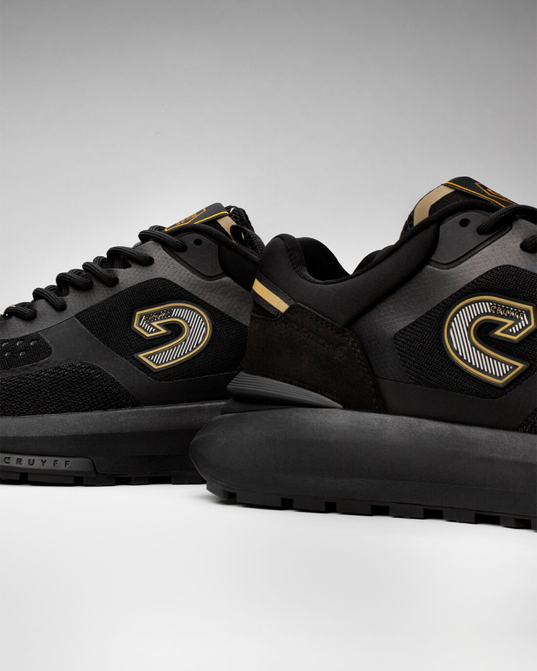 Cruyff trainers black and gold best sale